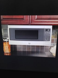 GE profile 1.1cu.ft. microwave countertop, hanging or built-in 800watt with sensor cooking scan to cook WiFi