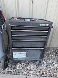 Broken wheel husky tool box that leans everything else is good