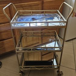 Gold Metal 3 Tiered Cart With Mirrored Shelves. $25.