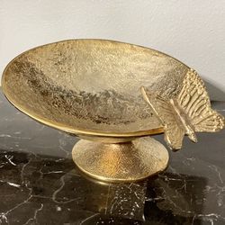 Beautiful asymmetrical metal pedestal bowl with butterfly.