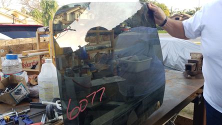 Factory tinted left side rear window.