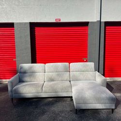 MODERN GREY FABRIC SECTIONAL COUCH/ 2 PIECES/ HEADRESTS ARE ADJUSTABLE/ IN GOOD CONDITION/ DELIVERY NEGOTIABLE 