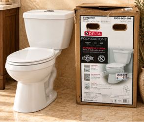 NEW in BOX Delta Toilet ELONGATED only