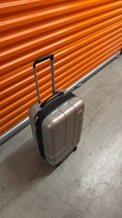 Silver carryon suitcase with 4 wheels