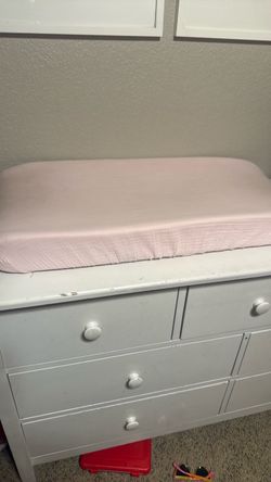 Changing pad and diaper caddy