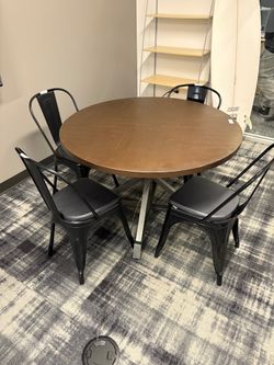 Industrial Style Round Dining Table with Four Black Metal Chairs
