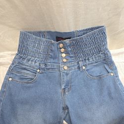 Butt lifting blue jeans