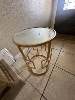 Glass top and gold trim end tables