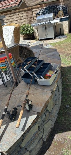 Complete fishing gear set includes two Quantum Tour USA rods with cork handles. One rod has a black Daiwa Regal-S 2500T spinning reel. The second rod 