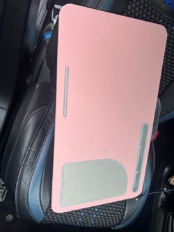 Pink portable laptop lap desk with built-in device/accessory slots and padded rest area. Used with minor signs of wear. Great for working, studying or