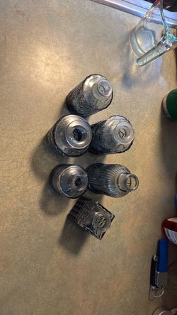 Set of six small blue tinted glass bottles
