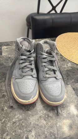 Gray High-Top Sneakers with Red Sole