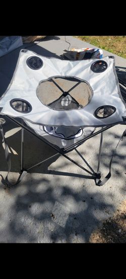NEW. OUTTERBANKS. CAMPING TABLE WITH COOLER AND SNACKHOLDER. WITH CARRYING BAG
2  COLORS.  GREY. GREEN. 
 11525 S HALSTED.  Dunkin Donuts/
7111.S WEST