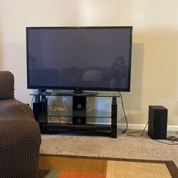 Tv Plus Sound System And Speakers Plus The Glass Entertainment Thing The Tv Sits On (ALL TOGETHER ONE PRICE) If You Just Want The Tv It’s Still 300$