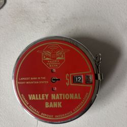 AI Overview    +4 This is a vintage Add-O-Bank coin bank, issued by the former Valley National Bank of Arizona