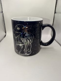 Black Ceramic Mug with Iridescent Character Design