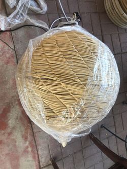 Big ball shaped light. Made of straw-like material.