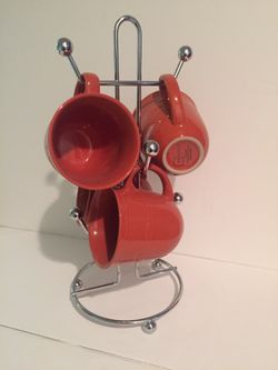 4 coffee cups and a holder