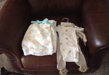 Newborn onsie and baby blanket