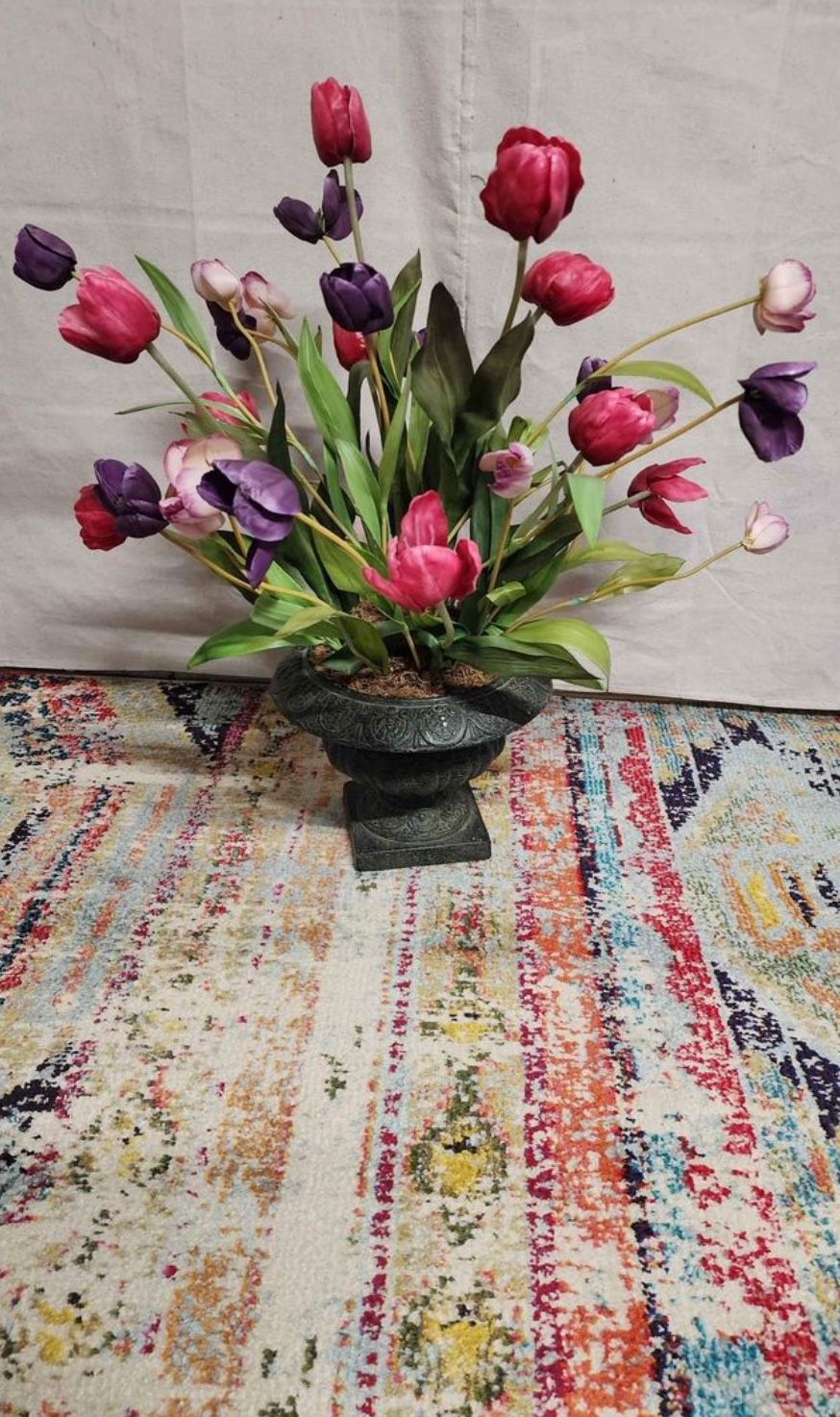 tulips in fancy heavy iron vase