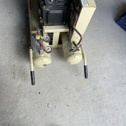 Portable air compressor with four hours on it