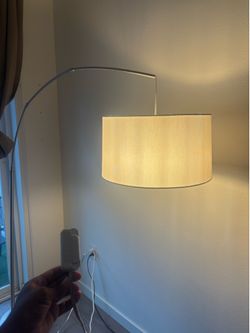 Overhang lamp with light adjuster