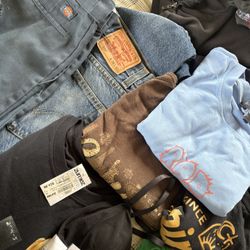 2 MYSTERY BAG OF CLOTHES. ( over 25 items, sone new with tags) 