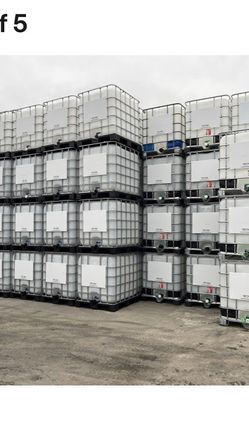 IBC Tanks 275 gallons 330 gallons. Caged Liquid Material Holding Containers