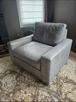 Arhaus Remington swivel chairs in leather