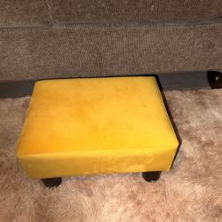 Small yellow ottoman