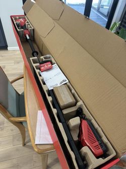 2 Brand new Milwaukee battery and 6 port rapid charger and lawn edger