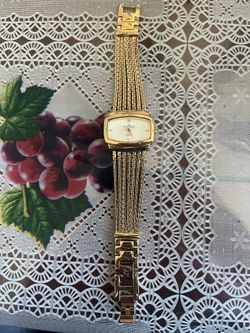 Anne Klein Women's 107208SVGB Diamond Accented Gold-Tone Bracelet Watch