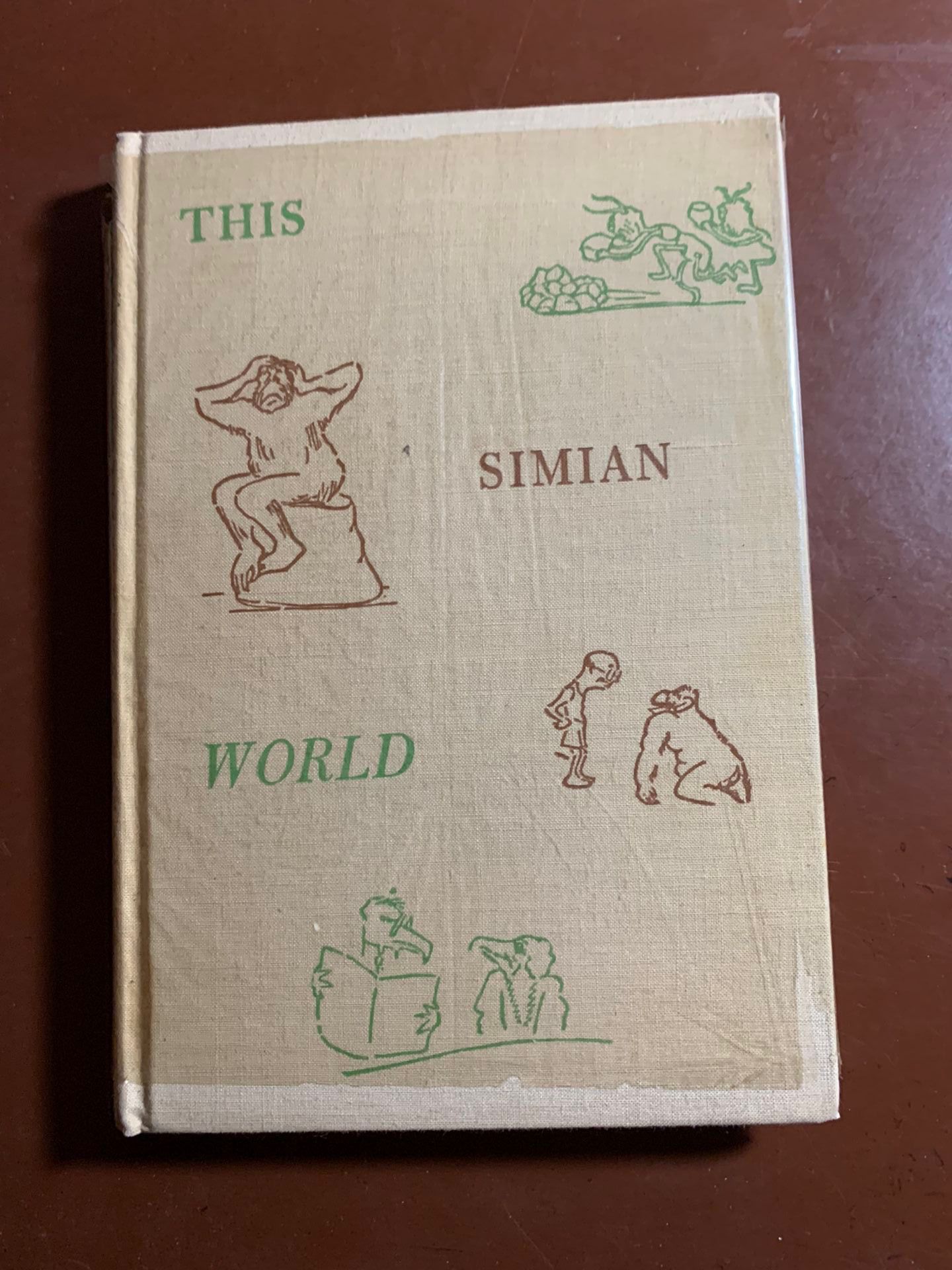 THIS SIMIAN WORLD by Clarence Day 1936.  BOOK IS IN PRISTINE CONDITION AND STILL HAS A PROTECTIVE CLEAR COVER PROVIDED BY PUBLISHER.