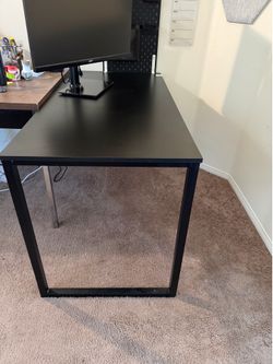 Black desk with ikea Pegboard + storage containers