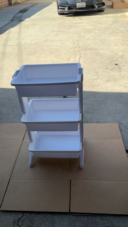 White plastic storage for toys make up etc.