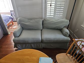 Light Blue-Green Slipcovered Loveseat