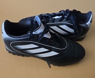 The Adidas Goletto IX TF J in a kids' size 1 (Core Black / Cloud White) is a youth turf soccer shoe