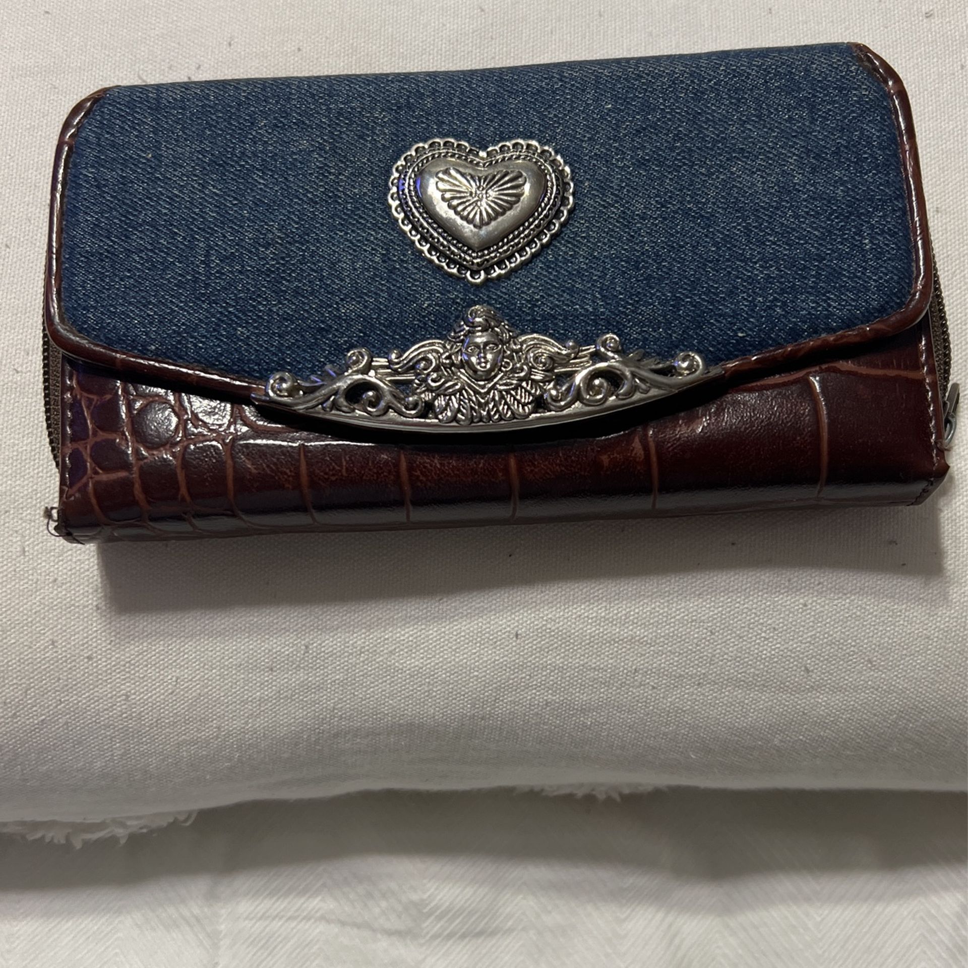 Beautiful Only $25. Western Wallet, LETHER WITH SILVER DECOR AND JEAN ON THE FRONT HAS SEVERAL DEPTS INSIDE THE WALLET ITS NEW AND BEAUTIFUL ONLY $40