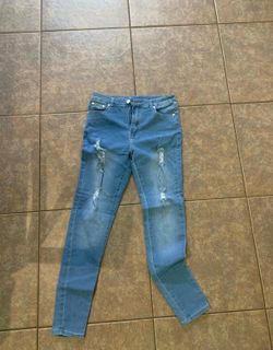 Blue ripped skinny Jeans size 14 kids size.   (N)