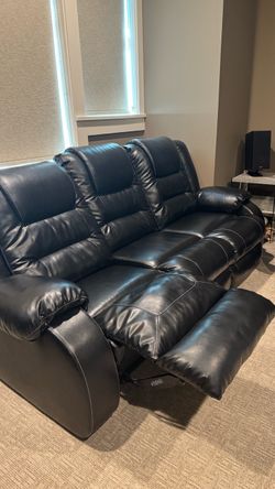 Reclining sofa and loveseat - black faux leather