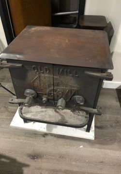 (WOOD STOVE)Antique Old Mill wood stove