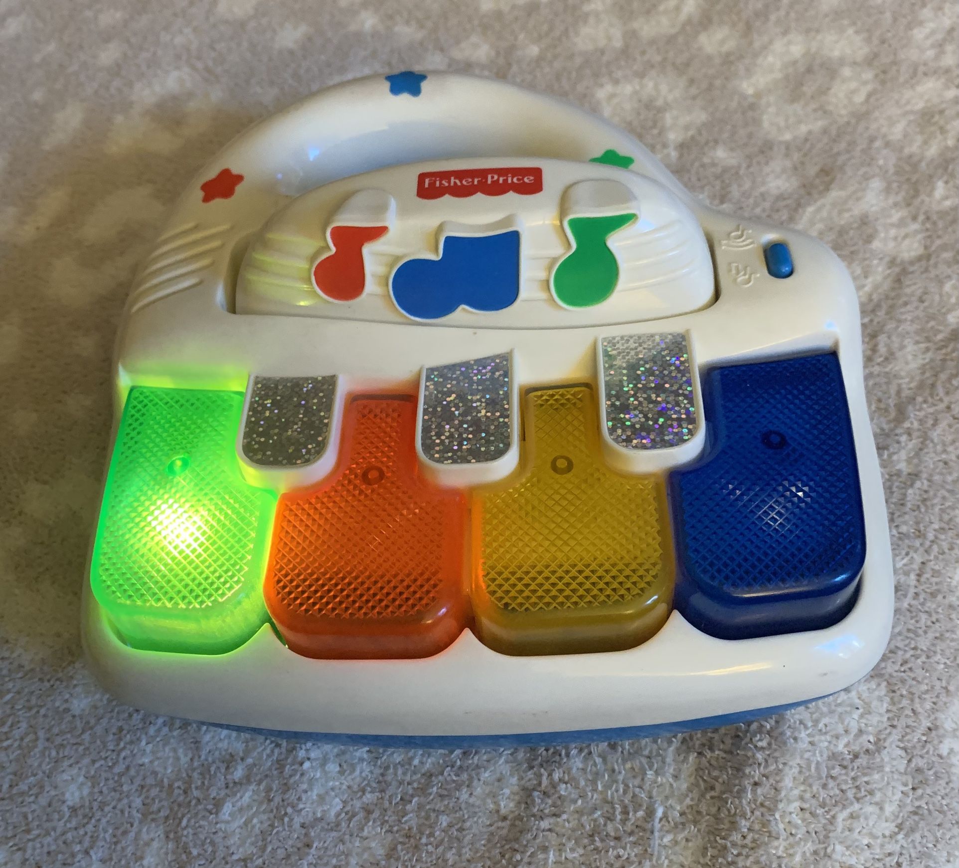 1999 FISHER PRICE Vintage light up top piano from Fisher Price. Press keys colorful lights dance as one of 5 songs are played. Includes classical se