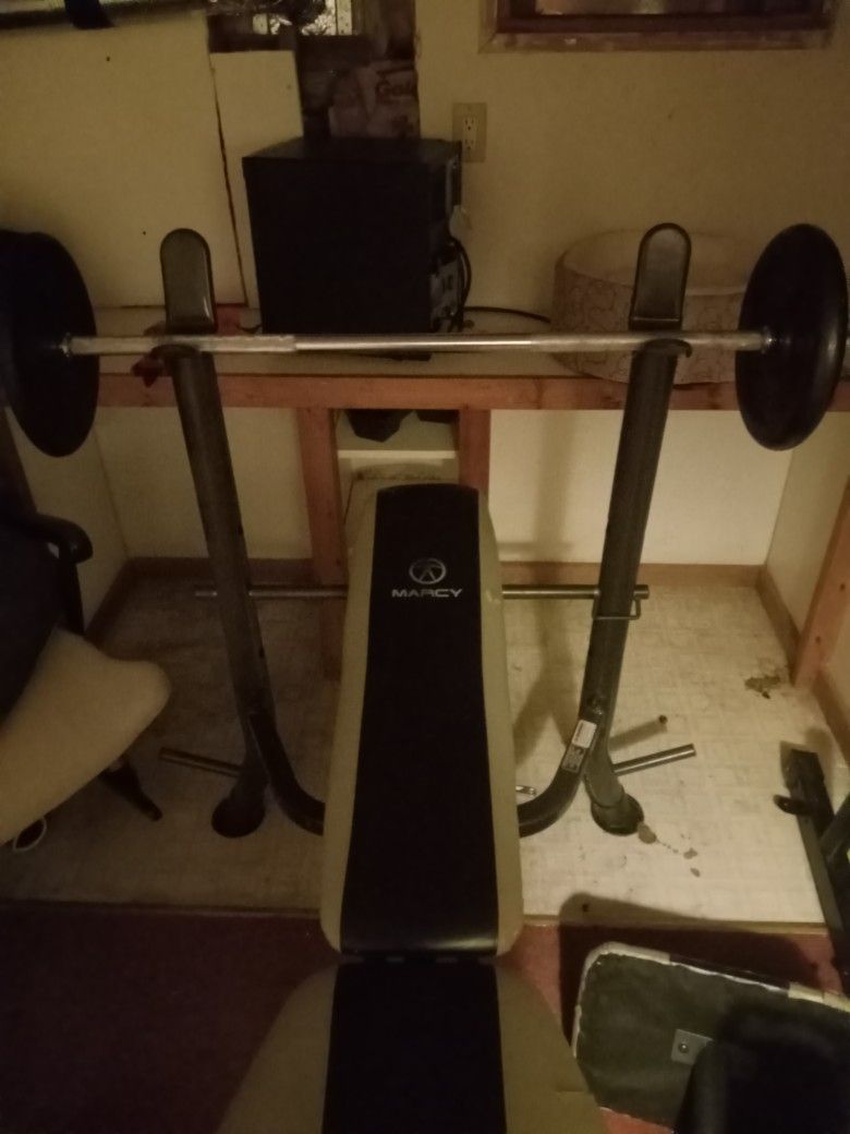 Bench Barbell and 200 Lbs Of Weight