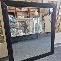 Boffi Art mirror with a black frame. 