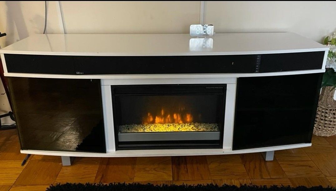 TV Stand With Fire Place And A Bluetooth Sound
