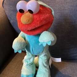 SESAME STREET Dino Stomp Elmo 13-Inch Plush Stuffed Animal Sings and Dances