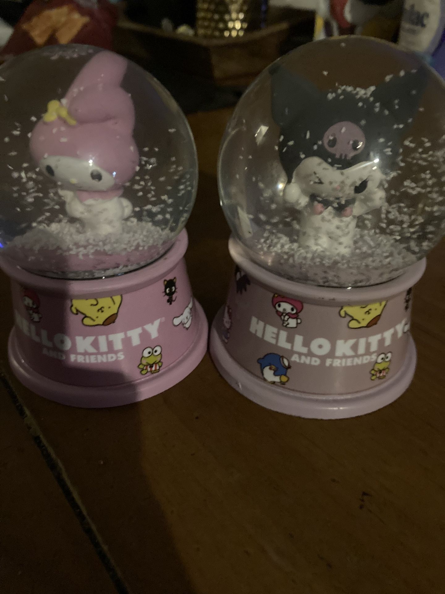 Two purple and pink Sanrio characters Rq