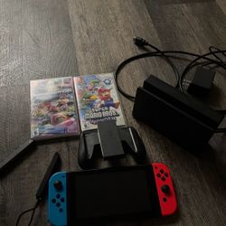 Nintendo Switch Neon Red/Blue + 2 Games (Mario Kart & Mario Wonder)