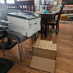 Color printer  with 27 toner cartridge  is white the brand  xexox