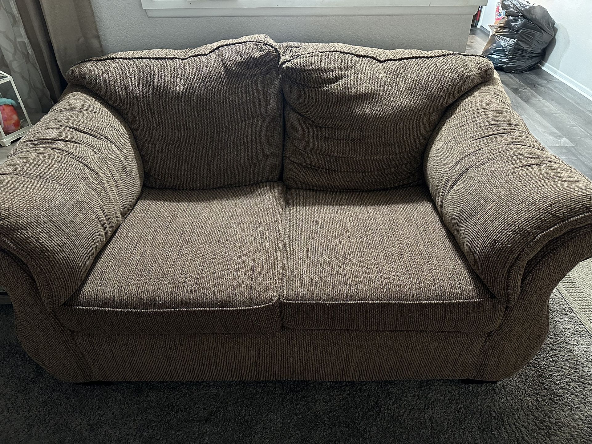 2 brown couches